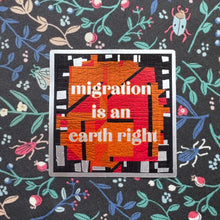 Load image into Gallery viewer, Textile with artistic design and text 'migration is an earth right' on a floral patterned background.
