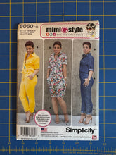 Load image into Gallery viewer, Simplicity 8060 H5 'mimi style' sewing pattern envelope for women's two-piece jumpsuits, displayed on a blue cutting mat with measurement markings.
